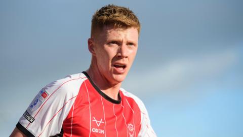Sam Clucas in action for Lincoln