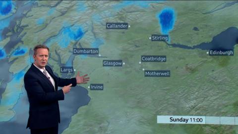 鶹Լ weather presenter Christopher Blanchett in front of weather map showing rain showers