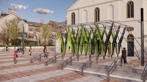 An artists impression of what the exhibition will look like outside the church in the city. It shows the church building with the artwork directly outside. It's green, yellow and black and also shows people walking past.