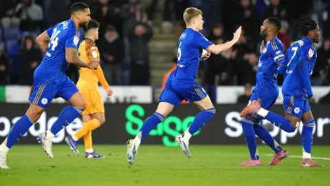 Jordan James runs back to the halfway line after equalising against Hull