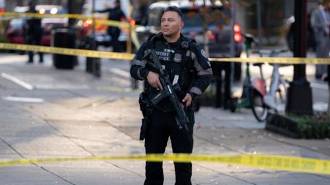 A member of the US Secret Service stands guard in a cordoned-off area near the White House in Washington, DC.