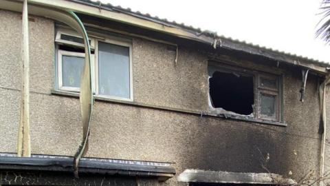 The upstairs of a house which has been burnt out by fire 