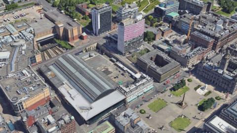 An aerial view of George Square, Glasgow Queen Street train station and North Hanover Street. Disused land is next to the station.