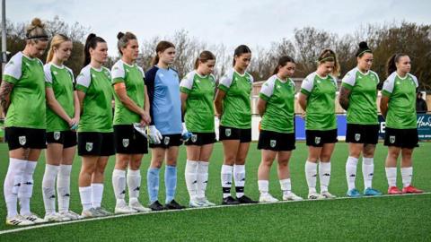 Guernsey FC Women line up on the centre circle before a game