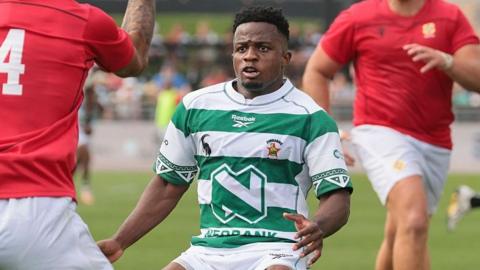 Edward Sigauke, wearing the green and white hooped shirt, in action for Zimbabwe in their Nations Cup match against Tonga in July 2026