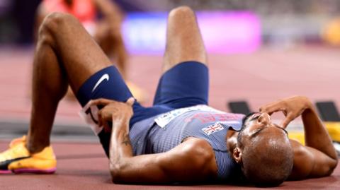 Matthew Hudson-Smith lies on the track after missing out on the men's 400m final