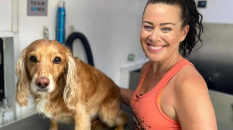 Caroline Donoghue with a cream spaniel