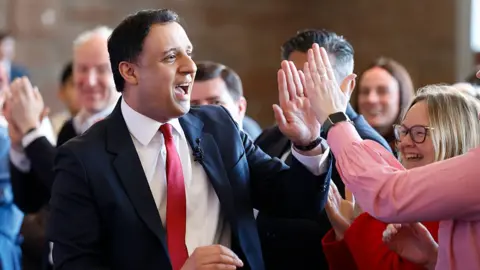 Anas Sarwar greets party colleagues at manifesto launch