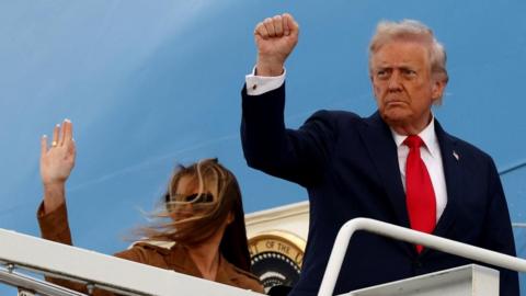 Donald Trump and first lady Melania board Air Force One