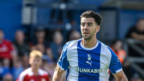 Joe Quigley in action for Oldham Athletic