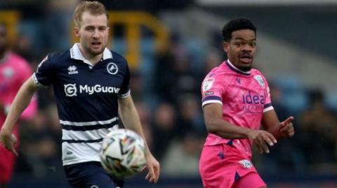 Billy Mitchell [left] of Millwall and Grady Diangana [right] of West Bromwich Albion