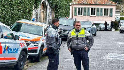 Police officers stand guard outside of the Omani ambassador's residence in Geneva, Switzerland, during indirect nuclear talks between the United States and Iran (17 February 2026)