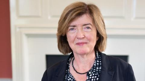 Sue Gray head and shoulders portrait as she smiles looking at the camera wearing a black and white shirt and black jacket with a black necklace, in her office in the Houses of Parliament on her first day as Starmer's chief of staff, taken in London on 4 September