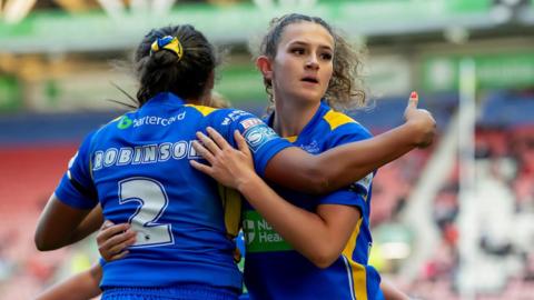 Leeds Rhinos' Sophie Robinson is congratulated by Ebony Stead