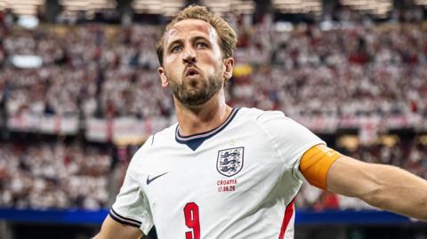 Harry Kane celebrates scoring for England