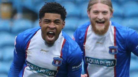 Kadeem Harris (left) celebrates a goal for Carlisle