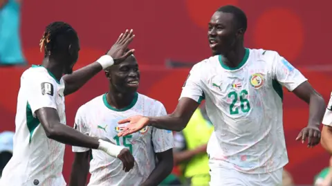 Pape Gueye celebrates after scoring