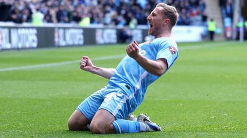 Coventry goalscorer Jamie Allen slides on his knees in celebration