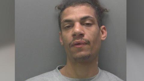 Custody image of Barry- wearing a grey T-shirt 