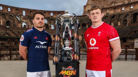 France captain Antoine Dupont and Wales skipper Jac Morgan pose with the Men's Six Nations trophy at the launch event in Rome