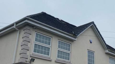 A house with a charred roof