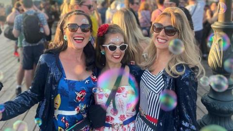 Elizabeth McGregor (L), Abby Fell (C) and Ciara Blacker (R) on the Victorian Pier 