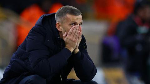 Gary O'Neil hides his face during Wolves' defeat by Ipswich Town