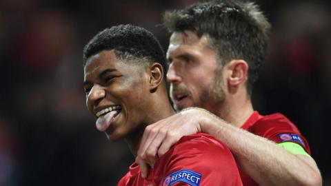 Marcus Rashford of Manchester United celebrates with team mate Michael Carrick