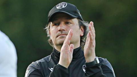 TNS boss Craig Harrison applauds after their draw with Shkendija earlier this month 