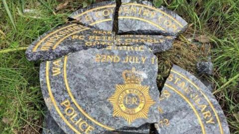 A smashed memorial plaque