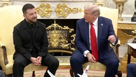 Zelensky and Trump sit together in the Oval Office