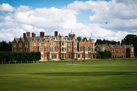 Sandringham House - the main house on the estate. It is a large building with a green lawn in front