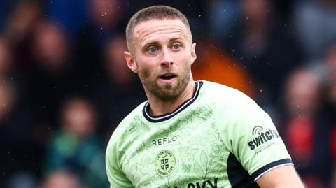Jordan Clark playing for Luton