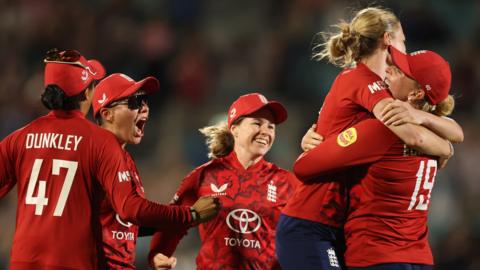 England players celebrate clinching victory over India in third T20
