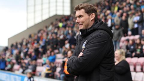 Matt Taylor looks on from the dugout