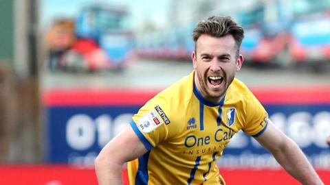 Rhys Oates celebrates scoring for Mansfield against Barnsley