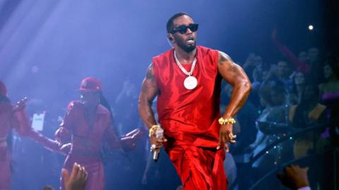 Sean Diddy Combs wearing red and big gold chain, Diddy performs onstage during the 2023 MTV Video Music Awards