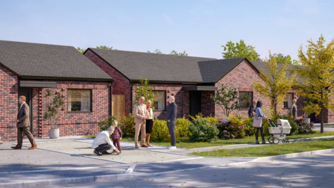 A computer-generated image of what some of the new homes could look like at the Lincoln Green Estate in Wolverhampton. Several men and women are standing or walking in the road outside the homes. The houses look like bungalows with red bricks and windows with small front gardens.