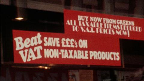 Sale sign in shop window advertising VAT free goods.