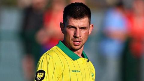 Darren Thomas in action for Caernarfon Town