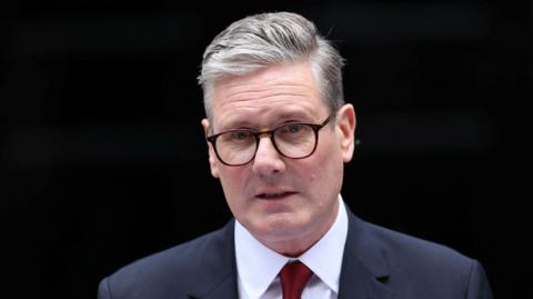 New Prime Minister Keir Starmer delivers his speech outside 10 Downing Street's famous black door.