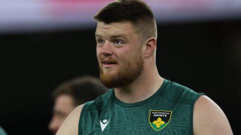Luke Green wearing a Northampton Saints vest top