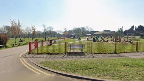 Wide shot of Sutton Lawn park under sunny skies