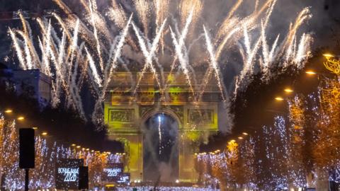 The Arc de Triumphe in Paris, surrounded by fireworks