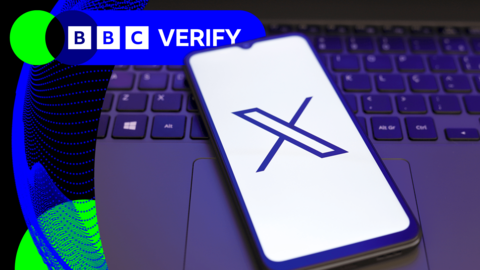 A stock image showing a smartphone displaying the X logo on a laptop keyboard