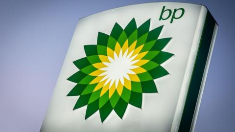 A large BP sign, with the green and yellow geometric flower logo.