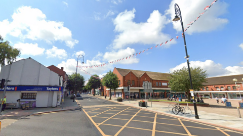 Brierley Hill High Street lines with lampposts which have bunting strung between them