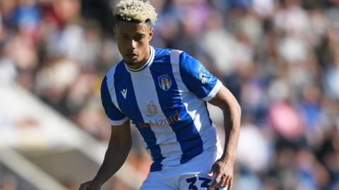Lyle Taylor in action for Colchester United