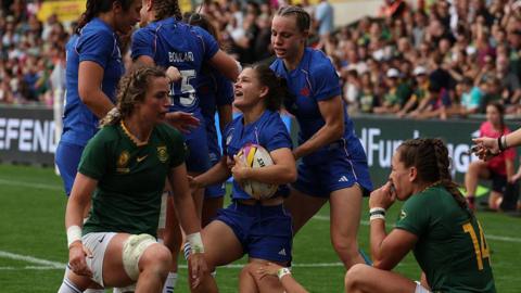 France hooker Agathe Gerin reacts to scoring a try 