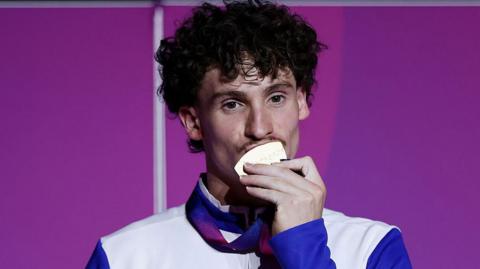 Reuben Ward with his gymnastics gold medal
